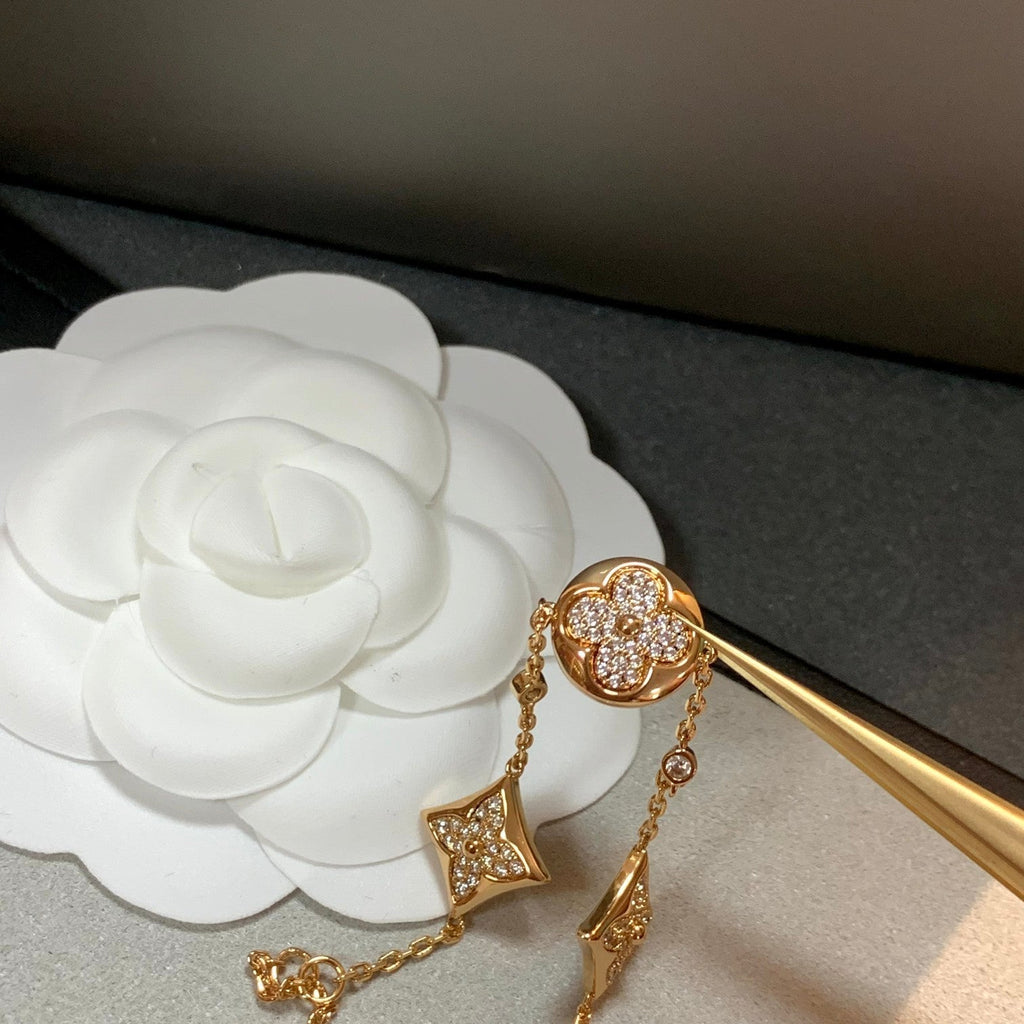 GlowSTAR AND SUN 4 MOTIFS GOLD DIAMONDS BRACELET