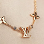 GlowSTAR AND SUN 7 MOTIFS GOLD BRACELET