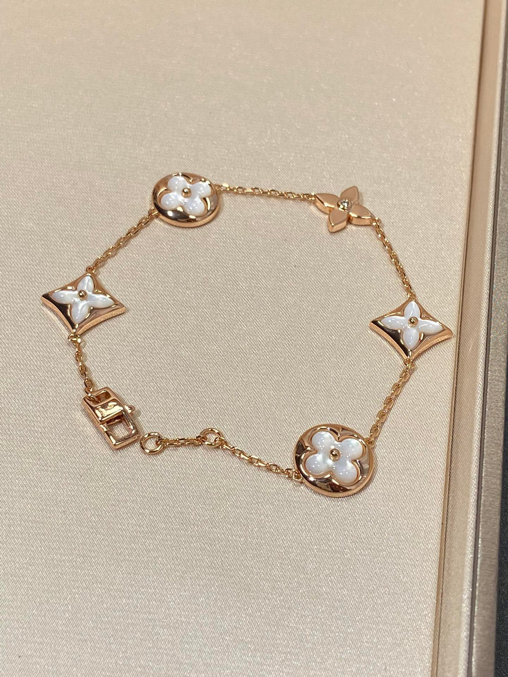 GlowSTAR AND SUN 5 MOTIF MOP PINK GOLD BRACELET
