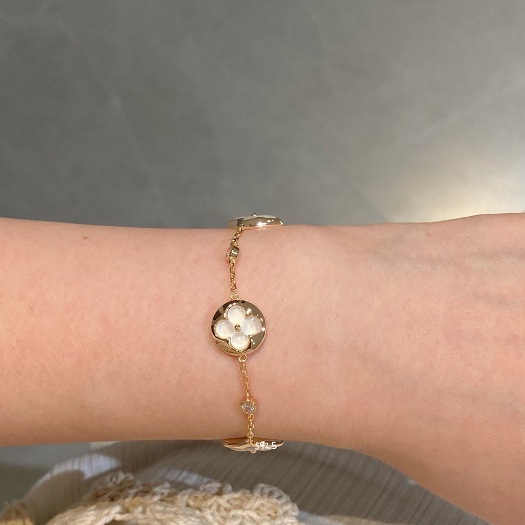 GlowSTAR AND SUN 4 MOTIF WHITE MOP PINK GOLD BRACELET